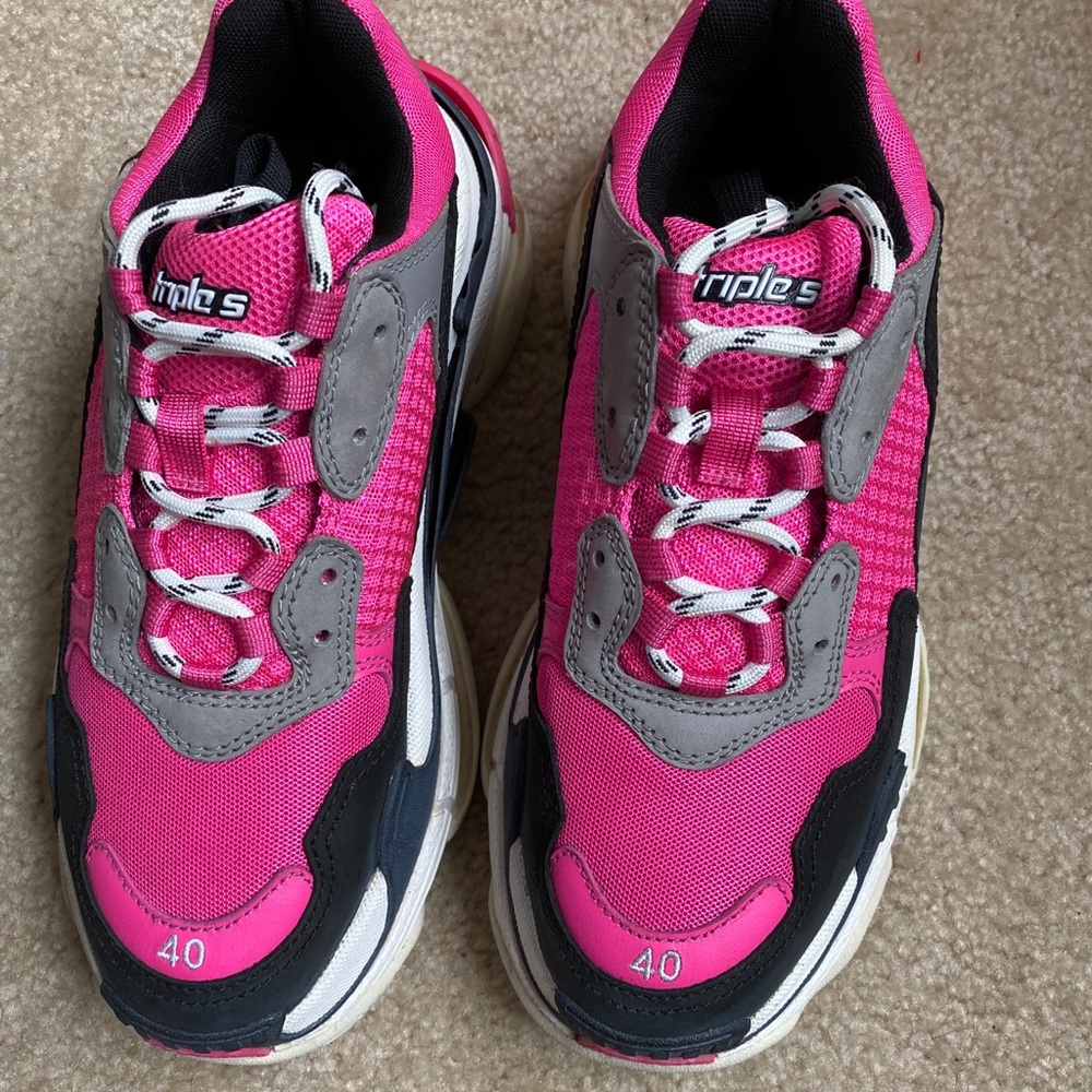 Pink, gray, black, and white Triple S balenciagas.